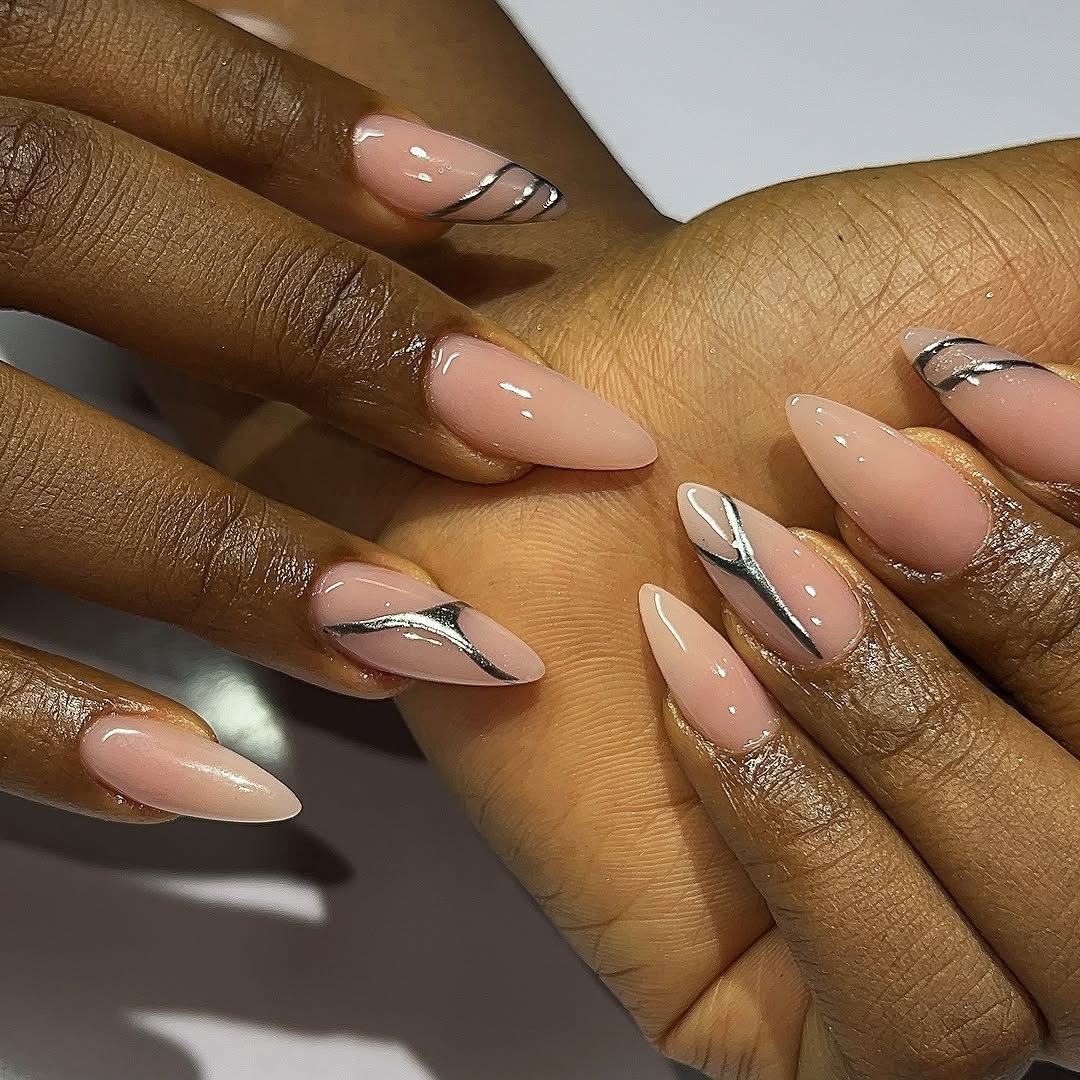 Nude stiletto nails with gold detail