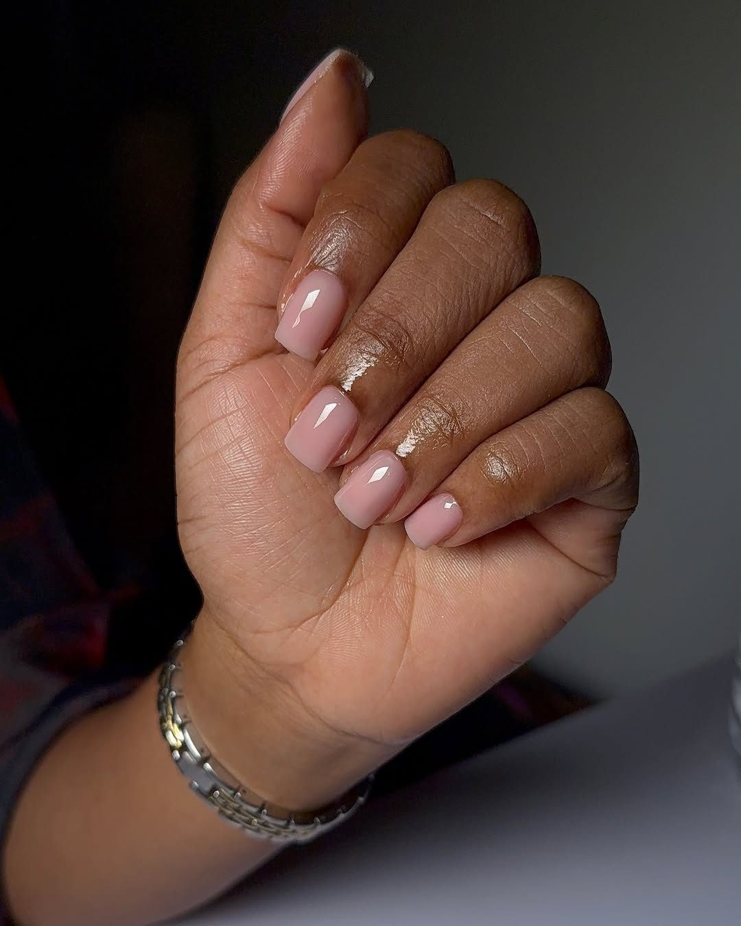 Natural nude manicure closeup