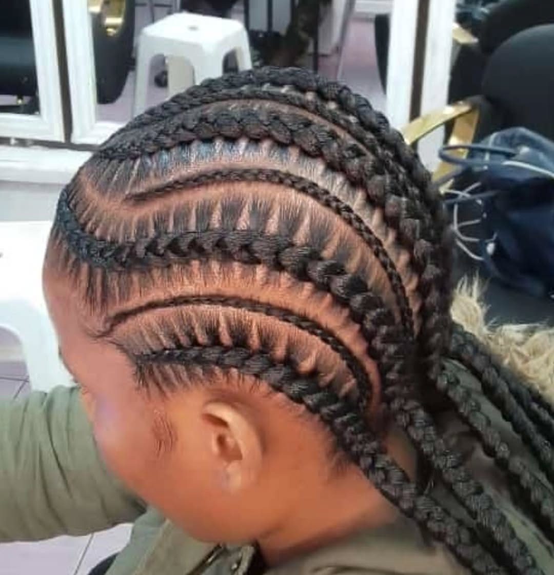 Cornrow braids low bun side view