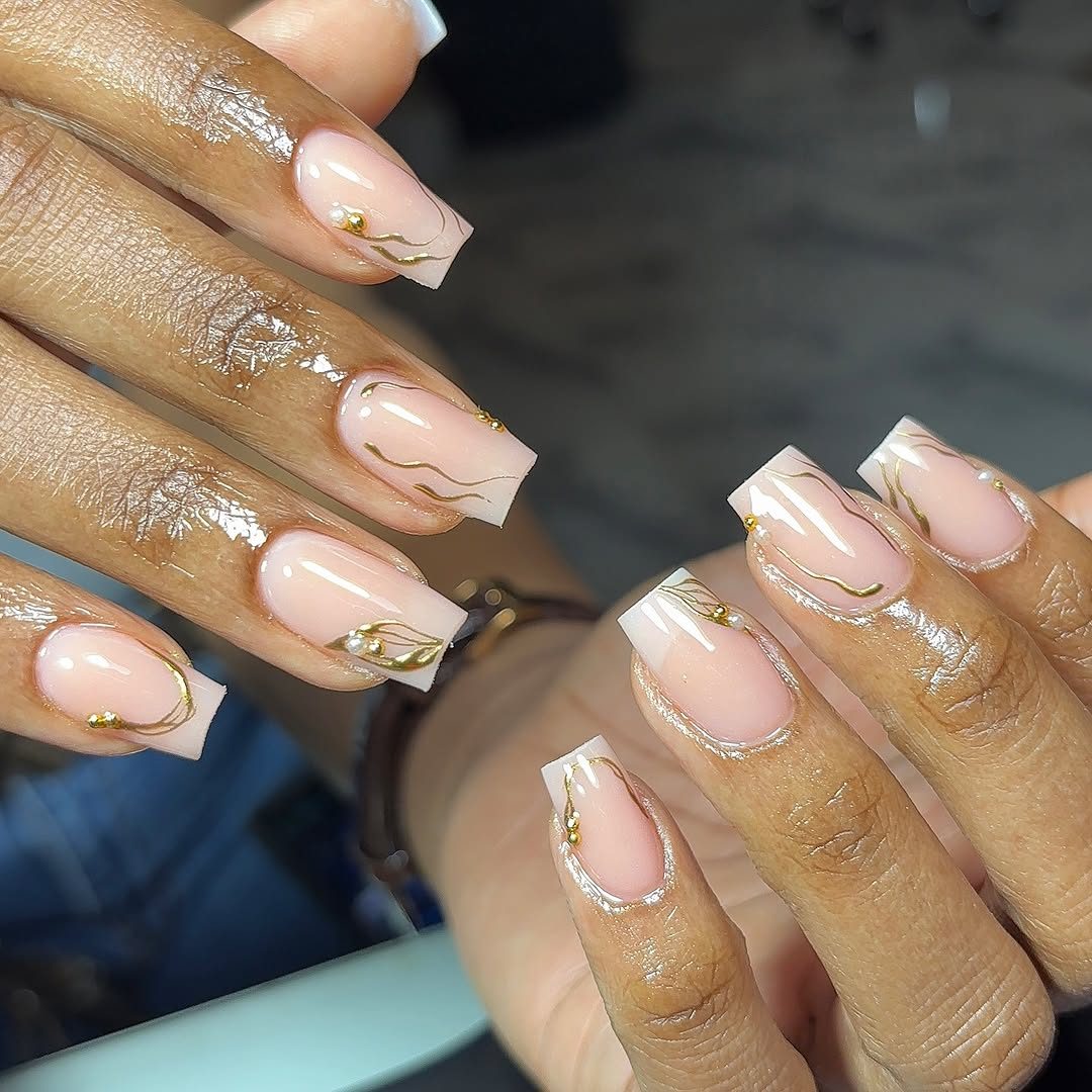 Nude pink nails with gold art
